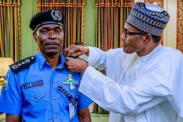 President Buhari and the New Acting Inspector General (IGP) of Police Adamu Muhammed President Buhari and the New Acting Inspector General (IGP) of Police Adamu Muhammed
