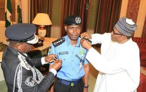 President Buhari and the New Acting Inspector General (IGP) of Police Adamu Muhammed