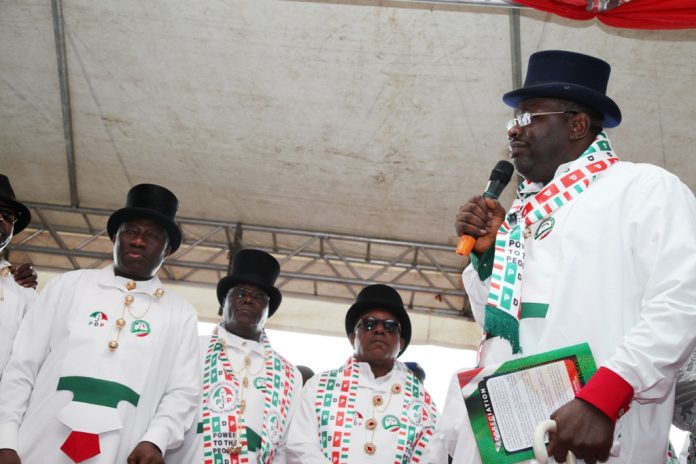 Bayelsa State Governor, Hon. Seriake Dickson (right) speaking during the Peoples Democratic Party Presidential Campaign Rally at the Ox-Bow Lake Pavilion/Boat Club, Swali Yenagoa, while the former President, Dr. Goodluck Jonathan (left) PDP Presidential Candidate, Alhaji Atiku Abubakar (2nd left) and the PDP National Chairman, Prince Uche Secondus (2nd right) look on. Photo by Lucky Francis.