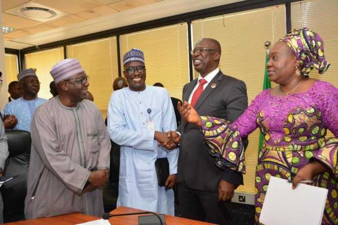 Permanent Secretary of the Ministry of Petroleum Resources, Dr. Folashade Yemi-Esan (right), introducing Heads of Departments and Agencies under the Ministry to the Minister of State for Petroleum Resources, Chief Timipre Sylva (2ndfrom right), as he exchanges pleasantries with the NNPC GMD, Mallam Mele Kyari (3rd from right) at a brief welcome event held for the Minister at the NNPC Towers, Abuja. With them is the Executive Secretary of the Petroleum Training Development Fund (PTDF), Dr. Bello Aliyu Gusau (left). Permanent Secretary of the Ministry of Petroleum Resources, Dr. Folashade Yemi-Esan (right), introducing Heads of Departments and Agencies under the Ministry to the Minister of State for Petroleum Resources, Chief Timipre Sylva (2ndfrom right), as he exchanges pleasantries with the NNPC GMD, Mallam Mele Kyari (3rd from right) at a brief welcome event held for the Minister at the NNPC Towers, Abuja. With them is the Executive Secretary of the Petroleum Training Development Fund (PTDF), Dr. Bello Aliyu Gusau (left).
