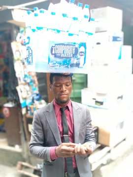 EFCC fetes man who sells sachet water in corporate wear