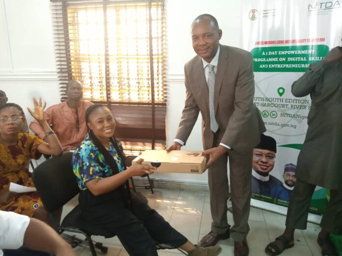 Dr. Aristotle Onumo Ag. Director Corporate Planning and Strategy making presentation onbehalf of the Director-General of NITDA.