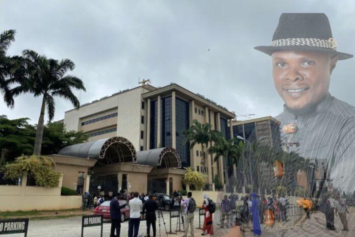 Journalists are seen stationed opposite the Federal High Court in Abuja, Nigeria on July 26, 2021 [Reuters/Abraham Achirga]