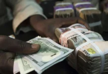 Naira drops against dollar amid fresh fuel price hike