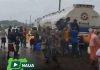 RESIDENTS SCOOP FUEL FROM LEAKING TANKER IN ASABA DESPITE EXPLOSION RISK