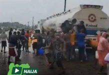 RESIDENTS SCOOP FUEL FROM LEAKING TANKER IN ASABA DESPITE EXPLOSION RISK